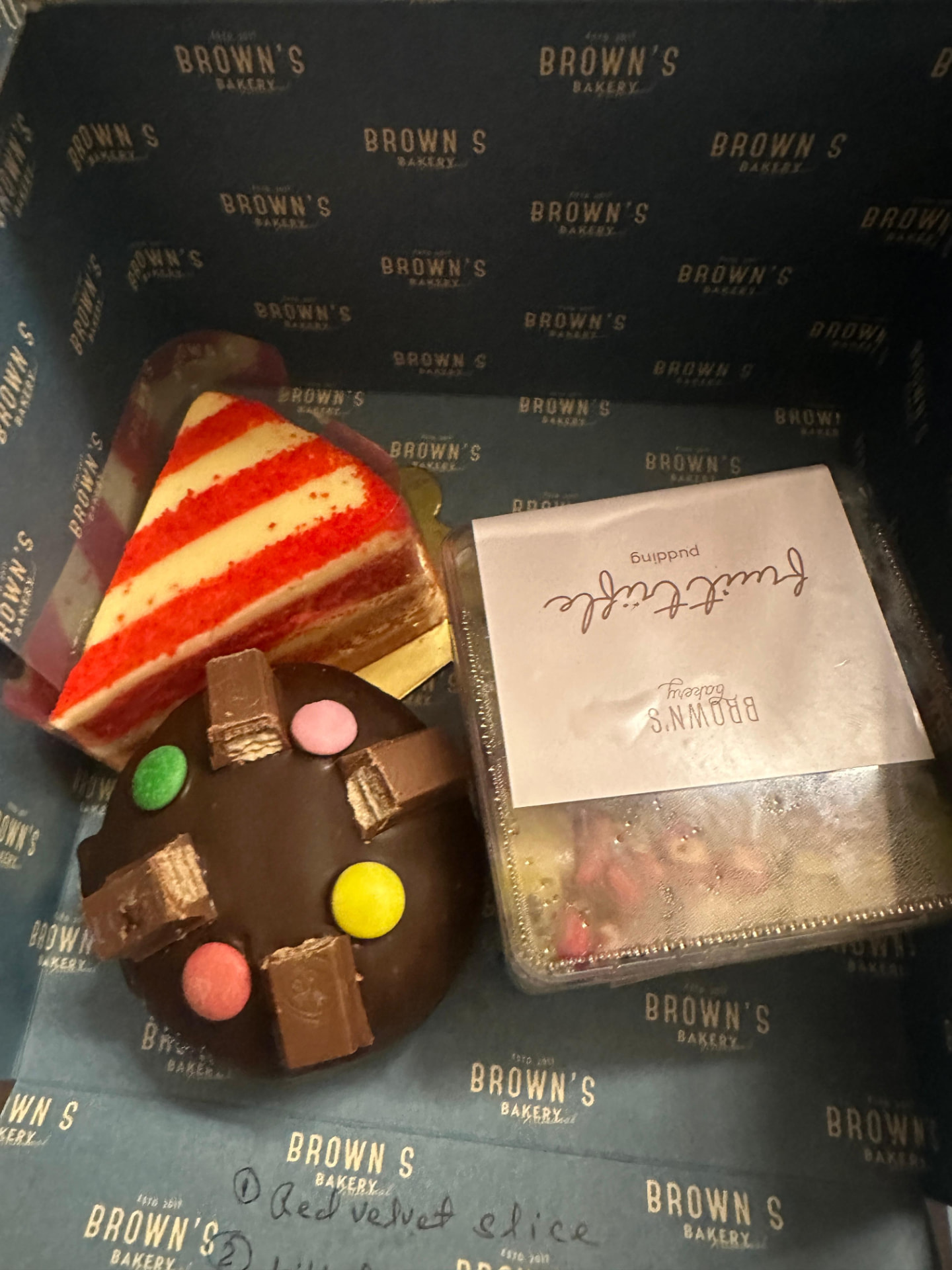Red velvet slice, chocolate candy cake and fruit trifle pudding